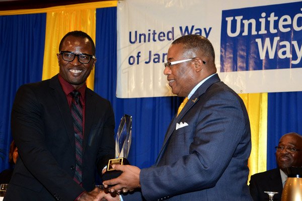 Winston Sill/Freelance Photographer
United Way of Jamaica annual Nation Builders'  Awards and  Employee Awards Ceremony, Held at the Jamaica Pegasus Hotel, New Kingston on Thursday September 11, 2014. Here are Marcus Steele (left), Managing Director, Carreras Limited; and Minister Anthony Hylton (right).