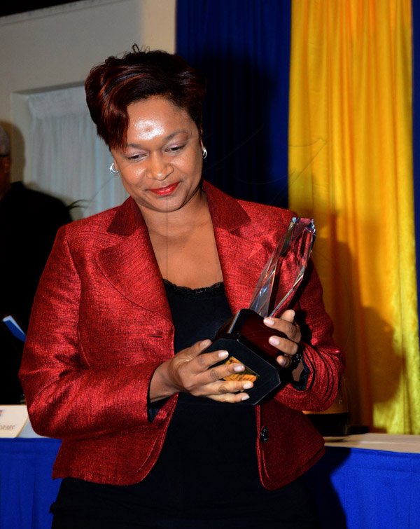Winston Sill/Freelance Photographer
United Way of Jamaica annual Nation Builders'  Awards and  Employee Awards Ceremony, Held at the Jamaica Pegasus Hotel, New Kingston on Thursday September 11, 2014. Here is Keri-Gaye Brown, SeniorVice President Group Legal, Compliance and Corporate Secretary, VMBS.