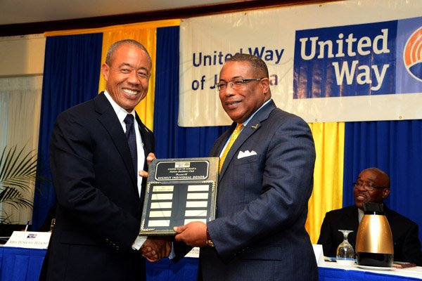 Winston Sill/Freelance Photographer
United Way of Jamaica annual Nation Builders'  Awards and  Employee Awards Ceremony, Held at the Jamaica Pegasus Hotel, New Kingston on Thursday September 11, 2014. Here are Dr. Robert Chen (left), the Highest  Individual Donor; and Minister Anthony Hylton (right).