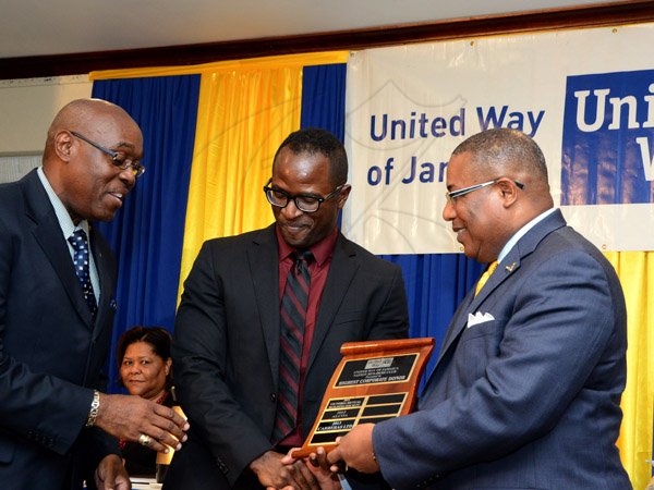 Winston Sill/Freelance Photographer
United Way of Jamaica annual Nation Builders'  Awards and  Employee Awards Ceremony, Held at the Jamaica Pegasus Hotel, New Kingston on Thursday September 11, 2014. Here are Ian Forbes (left), Chairman, United Way of Jamaica; Marcus Steele (centre), Managing Director, Carreras Limited; and Minister Anthony Hylton (right). Carreras Limited won the Highest Corporate Donor Award.