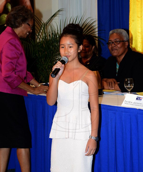 Winston Sill/Freelance Photographer
United Way of Jamaica annual Nation Builders'  Awards and  Employee Awards Ceremony, Held at the Jamaica Pegasus Hotel, New Kingston on Thursday September 11, 2014. Here is Jozannah Yap performing a musical item.