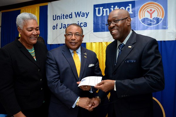 Winston Sill/Freelance Photographer
United Way of Jamaica annual Nation Builders'  Awards and  Employee Awards Ceremony, Held at the Jamaica Pegasus Hotel, New Kingston on Thursday September 11, 2014. Here are Winsome Wilkins (left), CEO, United Way of Jamaica;  Minister Anthony Hylton (centre); and Ian Forbes (right), Chairman, United Way of Jamaica.