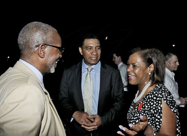 Winston Sill / Freelance Photographer
Dr. Raymond Brown (left), US Deputy Chief of Mission and Opposition Leader Andrew Holness (centre) chats with US Ambassador Pamella Bridgewater US Ambassador Pamela Bridgewater at a presidential election watch reception held at the ambassador's Paddington Terrace residence last night.