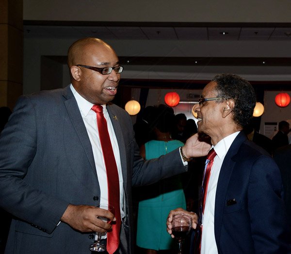 Winston Sill/Freelance Photographer
Delano Franklin and Patrick Atkinson catch up over fine wine at The United States of America Embassy host 238th  Anniversary  of Independence Reception