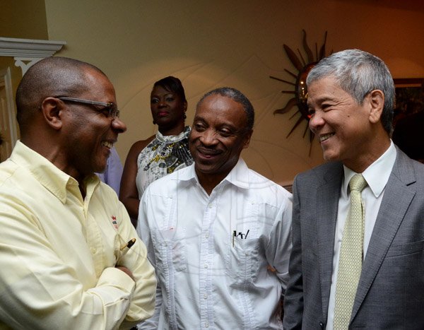Winston Sill/Freelance Photographer
USAID/Jamaica host Appreciation Reception for their various partners and the private sector, for over 52 years, held at the Knutsford Court Hotel, Ruthven Road on Tuesday night December 9, 2014. Here are Courtney Campbell (left); Milton Samuda (centre); and Kevin Hendrickson (right).
