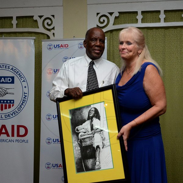 Winston Sill/Freelance Photographer
USAID/Jamaica host Appreciation Reception for their various partners and the private sector, for over 52 years, held at the Knutsford Court Hotel, Ruthven Road on Tuesday night December 9, 2014. Here are Dr. Henley Morgan (left); and Denise Herbol (right), Mission Director, USAID.