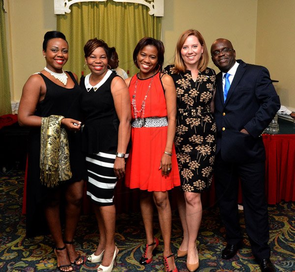 Winston Sill/Freelance Photographer
USAID/Jamaica host Appreciation Reception for their various partners and the private sector, for over 52 years, held at the Knutsford Court Hotel, Ruthven Road on Tuesday night December 9, 2014. Here are Marcia Whyte (left); Joan Campbell (second left);  Simone Sewell-Walker (centre); Suzanne Ebert (second right); and Kenneth Williams (right), all staff members, USAID.