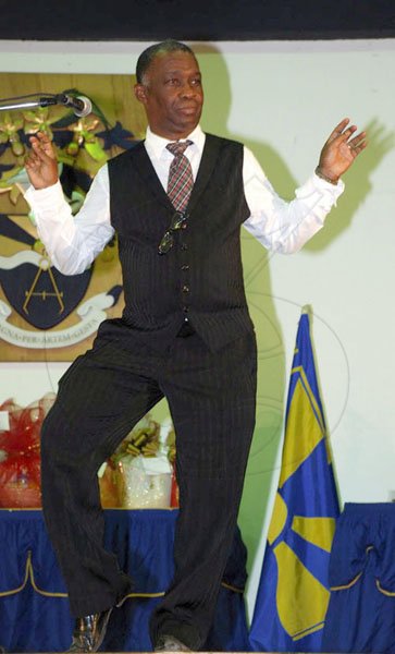 Colin Hamilton/freelance photographer
Guest speaker Mr. Sydney Bartley (Principal Director, Entertainment and Culture,- Ministry of Youth, Sports and Culture) shows some dance moves as part of his????????? address during UTECH Annual Sports Awards Ceremony at the Alfred?Sangster Auditorium on Thursday February 11, 2010.