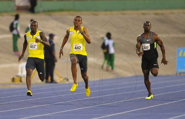 Ricardo Makyn/Staff Photographer 
 From left Daniel Bailey of Racers Track club with team mate Warren Weir and Nesta Carter of the MVP Tarck Club Men's  200 Meter   at the Utech Classic's held at the National stadium on Saturday 13.4.2013