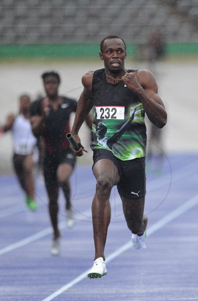 Ricardo Makyn/Staff Photographer.
Usain Bolt Anchors His Racers team to victory in the Men's 4 X100 meter in a meet record time of 37.82 seconds while finishing second is Asafa powell for MVP IN 38.27 seconds   at the Utech Classics held at the National Stadium on Saturday 15.4.2012