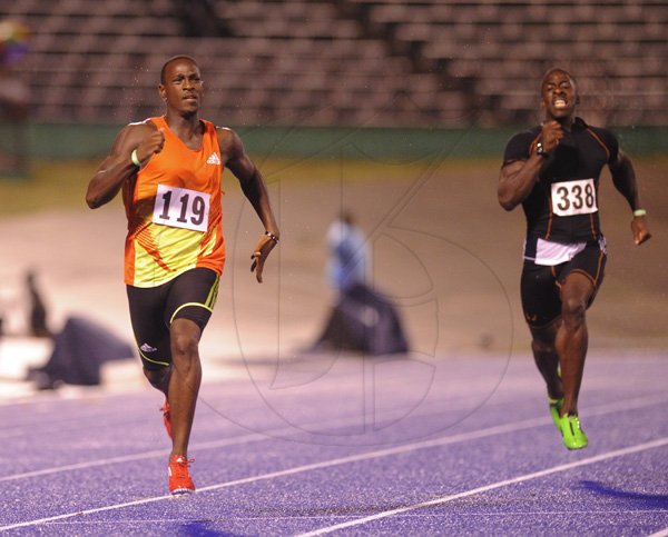 Ricardo Makyn/Staff Photographer.
Ricardo Chambers winning the His heat in the Mens 200  Meter while Dwayne Chambers finishes behind   at the Utech Classics held at the National Stadium on Saturday 15.4.2012