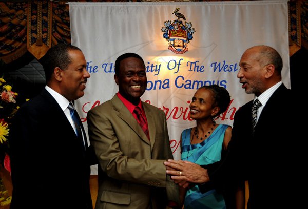 Winston Sill / Freelance Photographer
The University of the West Indies (UWI) Mona, Jamaica Long Service AwardsDinner,held at the Mona Visitors Lodge on Thursday night December 13, 2012. Here are Prof. Gordon Shirley (left); Anthony Sheriffe (second left, 40 year lobg serviceawardee; Dr. Camile Bell-Hutchinson (second right); and Douglas Orane (right).