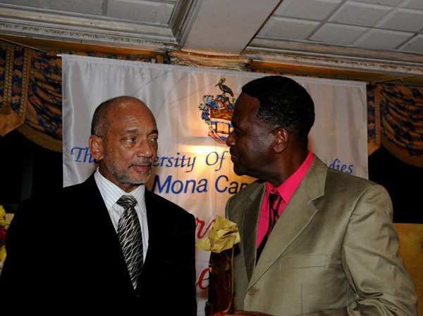 Winston Sill / Freelance Photographer
The University of the West Indies (UWI) Mona, Jamaica Long Service AwardsDinner,held at the Mona Visitors Lodge on Thursday night December 13, 2012. Here are Douglas Orane (left); and Anthony Sheriffe (right), 40 year long service awardee.