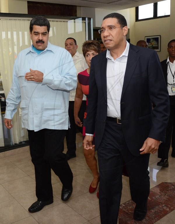 Rudolph Brown/Photographer
Prime Minister Andrew Holness,(right) chat with Nicolás Maduro, (left) the President of the Bolivian Republic of Venezuela at Jamaica House during a Working Visit to Jamaica on Sunday, May 22, 2016