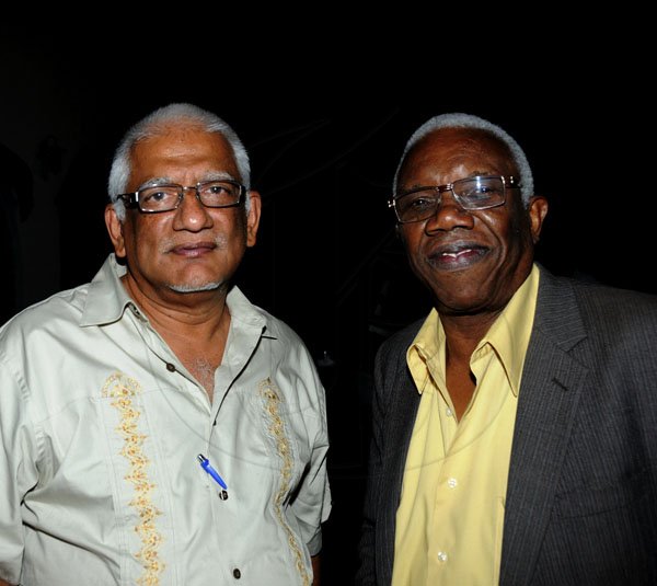 Winston Sill / Freelance Photographer
UWI Vice Chancellor Prof. Nigel Harris host Christmas Party, held at Long Mountain Road, UWI, Mona on Thursday night December 8, 2011. Here are Pro. Vice Chancellor Prof. Clement Sankat (left), Principal, UWI, St. Augustine; and Dr. Basil Burke (right), CEO, UWI Consulting.