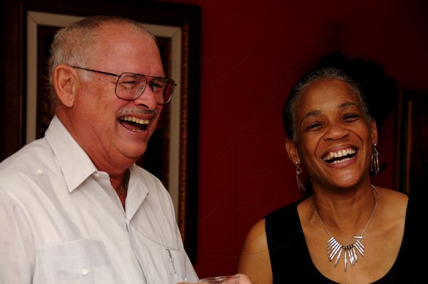 Winston Sill / Freelance Photographer
UWI Vice Chancellor Prof. Nigel Harris host Christmas Party, held at Long Mountain Road, UWI, Mona on Thursday night December 8, 2011. Here are Prof. Peter Fletcher (left); and Dr. Yvette Williams-Harris (right).