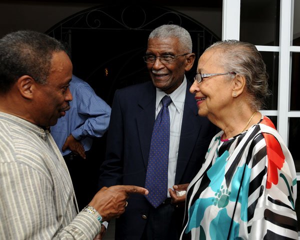 Winston Sill / Freelance Photographer
UWI Vice Chancellor Prof. Nigel Harris host Christmas Party, held at Long Mountain Road, UWI, Mona on Thursday night December 8, 2011. Here are Milton Samuda (left); Prof Hugh Wynter (centre); and Mrs.----???? Wynter (right).