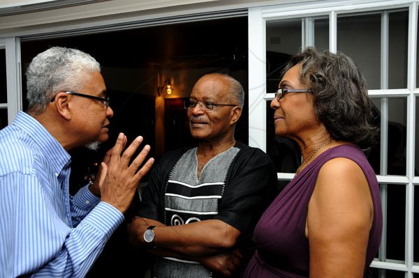 Winston Sill / Freelance Photographer
UWI Vice Chancellor Prof. Nigel Harris host Christmas Party, held at Long Mountain Road, UWI, Mona on Thursday night December 8, 2011. Here are Prof. Harris (left); Sir Kenneth Hall (centre); and Lady Rheima Hall (right).