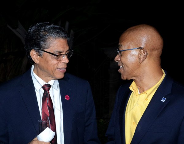 Winston Sill/Freelance Photographer
PUBLIC AFFAIRS DESK:----- President and CEO of Victoria Mutual Building Society (VMBS) Richard Powell (left) welcomes Milverton Reynolds, managing director of the Development Bank of Jamaica to the VMBS Anniversary Reception, held at The East Lawn, Devon House, Hope Road on Friday night November 14, 2014.
