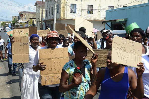 Ian Allen/Photographer
Residents of West Kingston stage a prayer walk through the constituency on Wednesday.