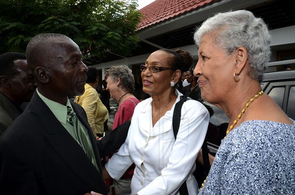 Gladstone Taylor / Photographer

Donald Cammoc (left) and Norma Ettrick greet and give emotional support to Elaine Perkins (center)

The funeral serivce for the life of Wilmot Harold Nash Perkins held at the Webster Memorial United Church, Kingston yesterday afternoon