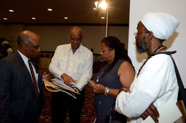 Winston Sill/Freelance Photographer
PUBLIC AFFAIRS DESK:-----Comparing notes (from left) Christopher Samuda, Conrad Graham, Pauline Findlay and Osa Osageboro.
Wolmers Trust presents the Media Launch of Ailey2, held at the Jamaica Pegasus Hotel, New Kingston on Thursday night may 29, 2014.