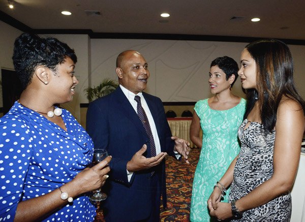 Winston Sill/Freelance Photographer
PUBLIC AFFAIRS DESK:-----Delta Airlines' Richard Pile holds court with Trafalgar Travel trio (from left) Lisa Henry, Tara Bradshaw and Simone DaSilva.
Wolmers Trust presents the Media Launch of Ailey2, held at the Jamaica Pegasus Hotel, New Kingston on Thursday night may 29, 2014.