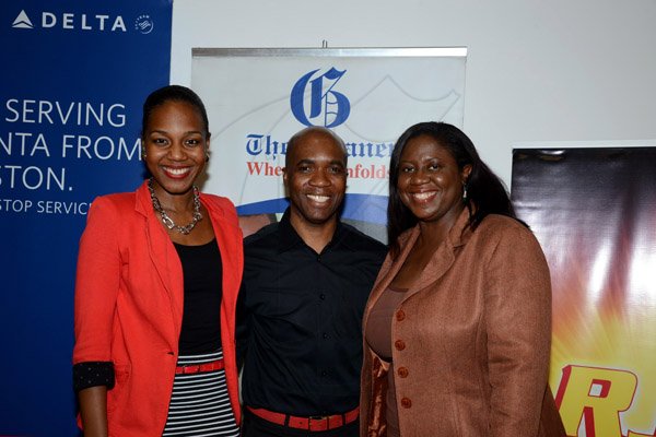 Winston Sill/Freelance Photographer
PUBLIC AFFAIRS DESK:-----Troy Powell, artistic director of Ailey II gets the paparazzi treatment with Gleaner duo Terri-Karelle Reid (left), online brand manager and Terry-Anne Wilson, assistant manager, Business Development and Marketing.Wolmers Trust presents the Media Launch of Ailey2, held at the Jamaica Pegasus Hotel, New Kingston on Thursday night may 29, 2014.