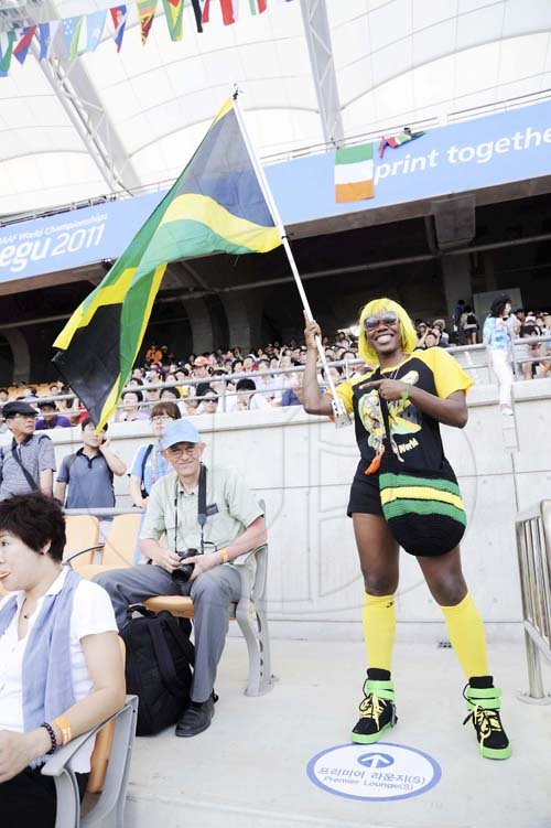Ricardo Makyn/Staff Photographer 
Jamaican supporter dressed in colours from head to toe, to represent her team Crowd scene, Daegu, South Korea yesterday..