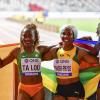 Newly crowned world champion Shelly-Ann Fraser-Pryce (center) celebrates her win along with silver medalist Dina Asher-Smith and Bronze medalist Marie Josep Ta Lou at the 2019 IAAF World Athletic Championships held at the Khalifa International Stadium in Doha, Qatar on Sunday September 29, 2019.