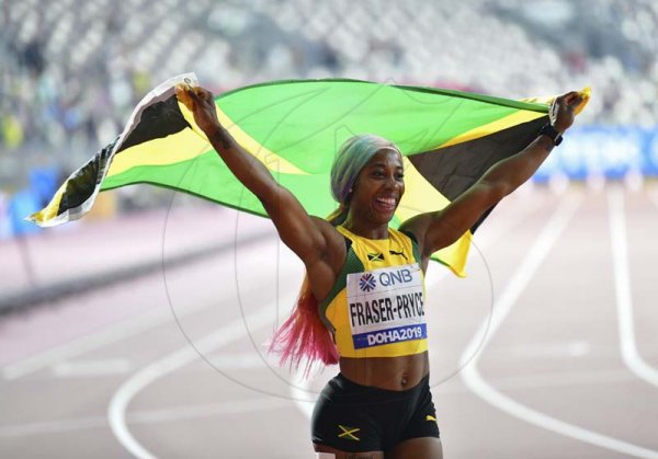 Newly crowned world champion Shelly-Ann Fraser-Pryce celebrates her win in the 100m women finals at the 2019 IAAF World Athletic Championships held at the Khalifa International Stadium in Doha, Qatar on Sunday September 29, 2019.