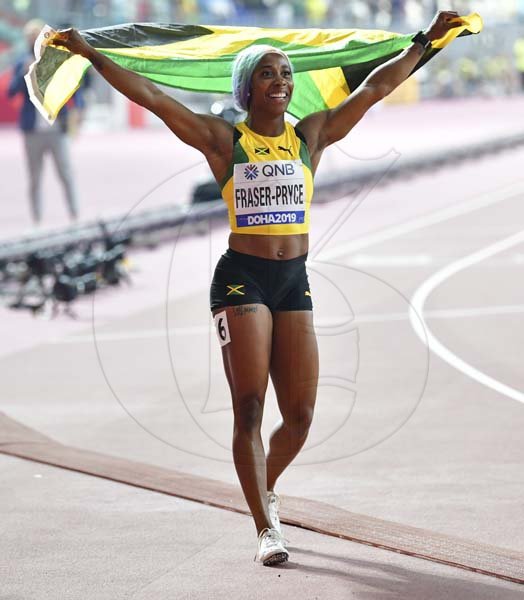 Newly crowned world champion Shelly-Ann Fraser-Pryce celebrates her win in the 100m women final at the 2019 IAAF World Athletic Championships held at the Khalifa International Stadium in Doha, Qatar on Sunday September 29, 2019.