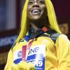 100m world champion Shelly-Ann Fraser-Pryce takes her place at the top of the medal platform to accept her gold medal for the 100m women event at the