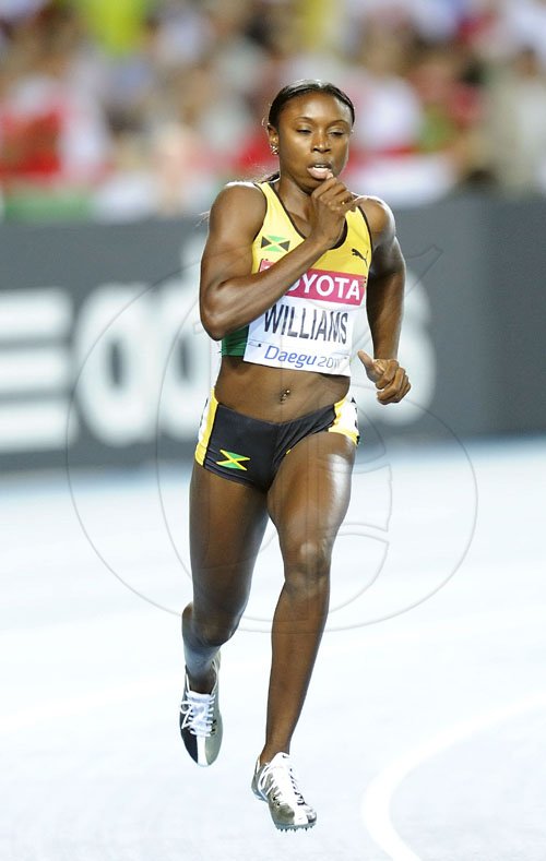 Ricardo Makyn/Staff Photographer
Jamaica Shericka Williams, ahead in the womens 400 meters.