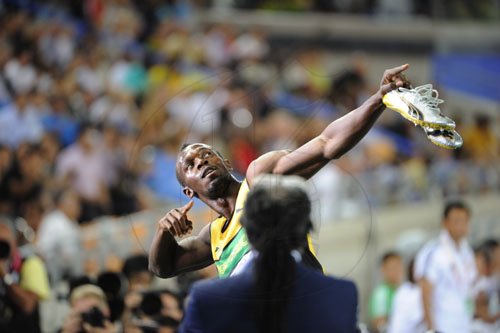 Ricardo Makyn/Staff Photographer                                  Usian Bolt celebrates after winning the 200m Semisl in Daegu.Sept.2,2011.