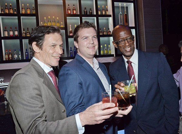 Winston Sill/Freelance Photographer
PUBLIC AFFAIRS
 Ryan Hanlon (centre) from the US Embassy, shares a toast to the new J Wray and Nephew Limited corporate offices with Jean-Jacques Dubau (left), chairman of J Wray and Nephew and Clement Lawrence, managing director of J Wray and Nephew. 
a Gruppo Campari Company present the Official Opening of the JWN Corporate Office,  at Dominica Drive, New Kingston on Thursday night April 10, 2014.
