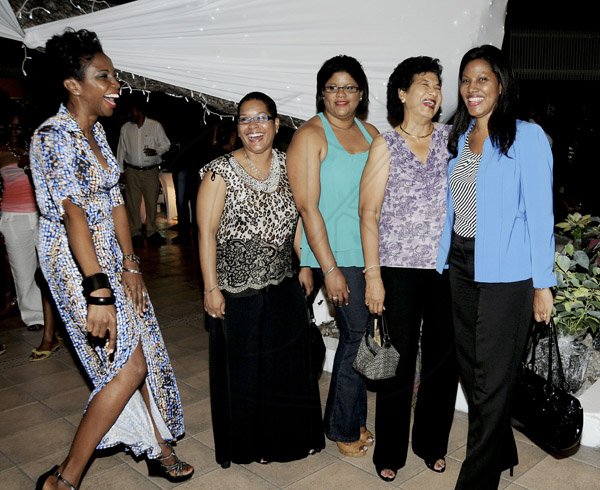 Winston Sill / Freelance Photographer
Wyndham Kingston Hotel host a "Winter Carnivale" Customer Appreciation Party, held at Wyndham Hotel, New Kingston on Friday night February 1, 2013. Here are Grace Morrison (left); Cheyenne McLarty (second left); Lisa Bryan (centre); Yvonne Sweeney (second right); and Nicola Madden-Greig (right).
