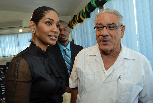 Rudolph Brown/Photographer
Lisa Hanna, Minister of Youth and Culture in discussion with James Moss Solomon, Chairman, Grace and Staff Community Development Foundation at NYS Summer Programme Press Launch at 6 Collins Green Avenue in Kingston on Wednesday, April 3, 2013